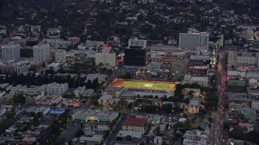Aerial footage of Hollywood High School football field at twilight in California