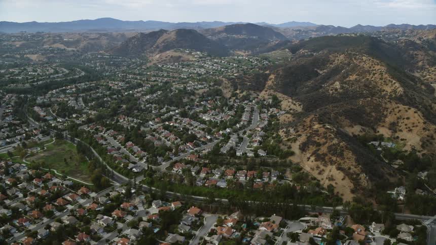 Fly above West Hills suburbia capturing the tract houses and hilltop views of Southern Californias residential community