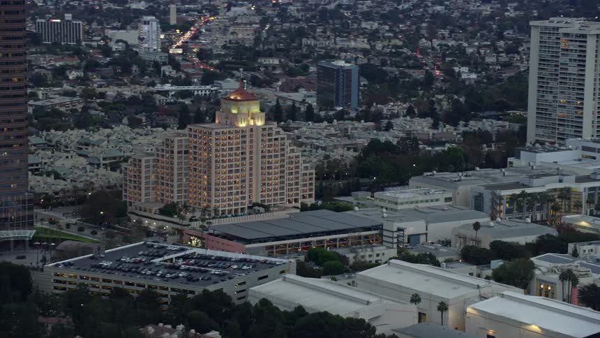A breathtaking aerial view of the Intercontinental Hotel at twilight towering over the neighborhood of Century City California