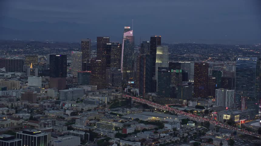 A breathtaking aerial view of Downtown Los Angeles skyline during twilight featuring the new supertall Wilshire Grand Center
