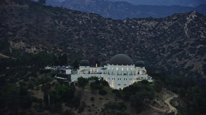 A stunning aerial view at twilight of the iconic Griffith Observatory in Los Angeles California showcasing the historic landmark and its scientific facilities during summer