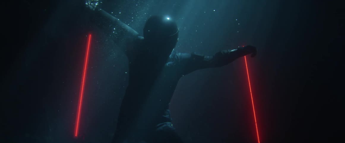 A person struggles to swim above water