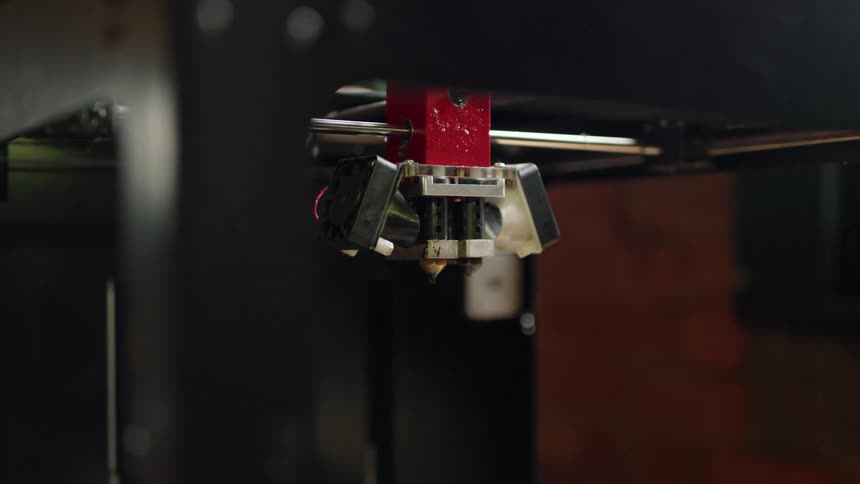 A machining drill on a silver bar