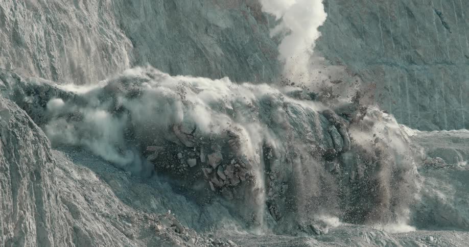 Rock mound at base of cliff collapses and releases dust