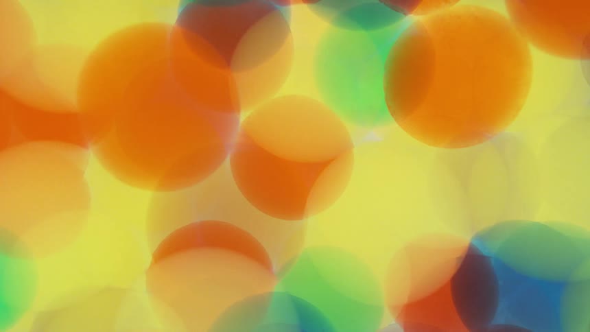 Colorful translucent circles overlap and spin