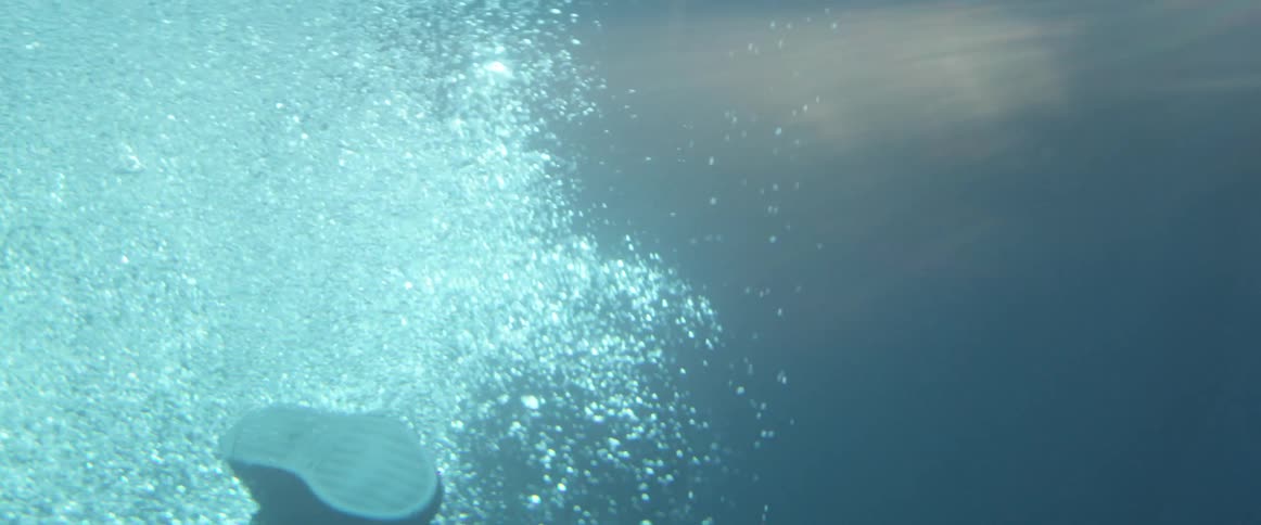 A person is swimming in a pool of water