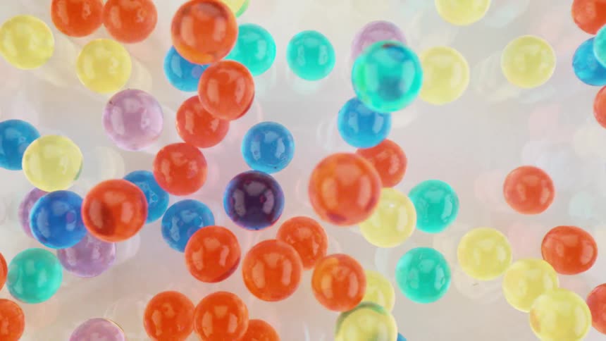 Colorful balls moving around on a surface