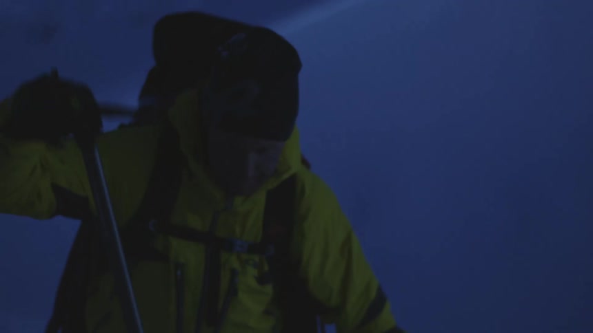 Man in Yellow Jacket Ascending with Backpack