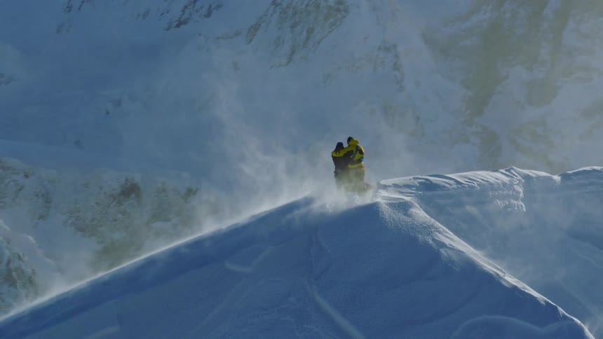 Overlooking Snowy Mountain Peaks: Embracing Love on Top