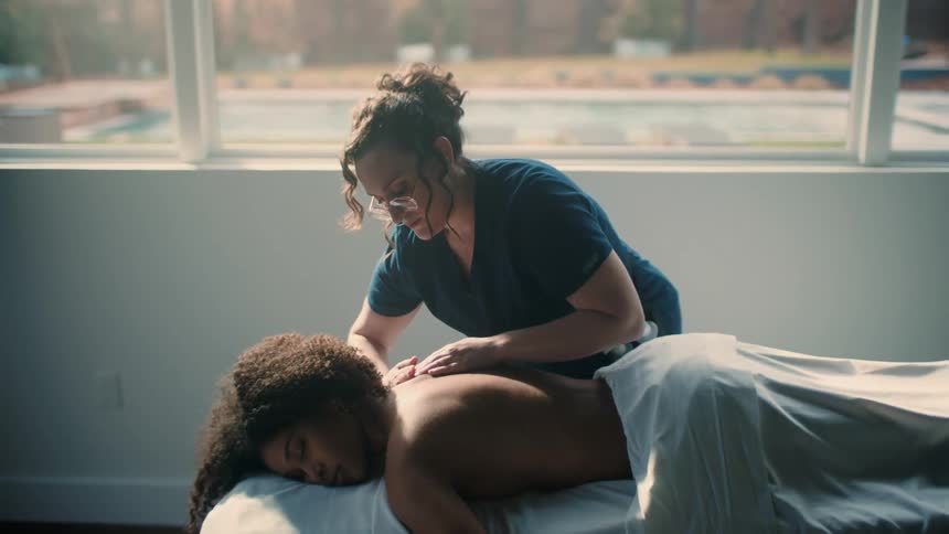 A woman is getting a massage at a spa