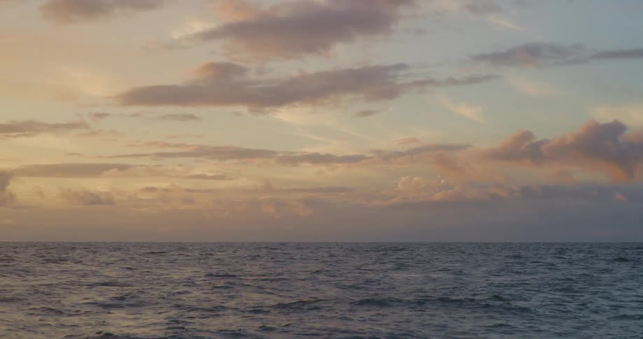 Panoramic view gentle sea waves at sunrise