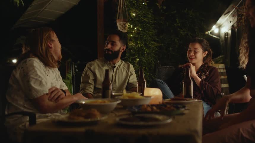 A group of friends are having dinner at a restaurant