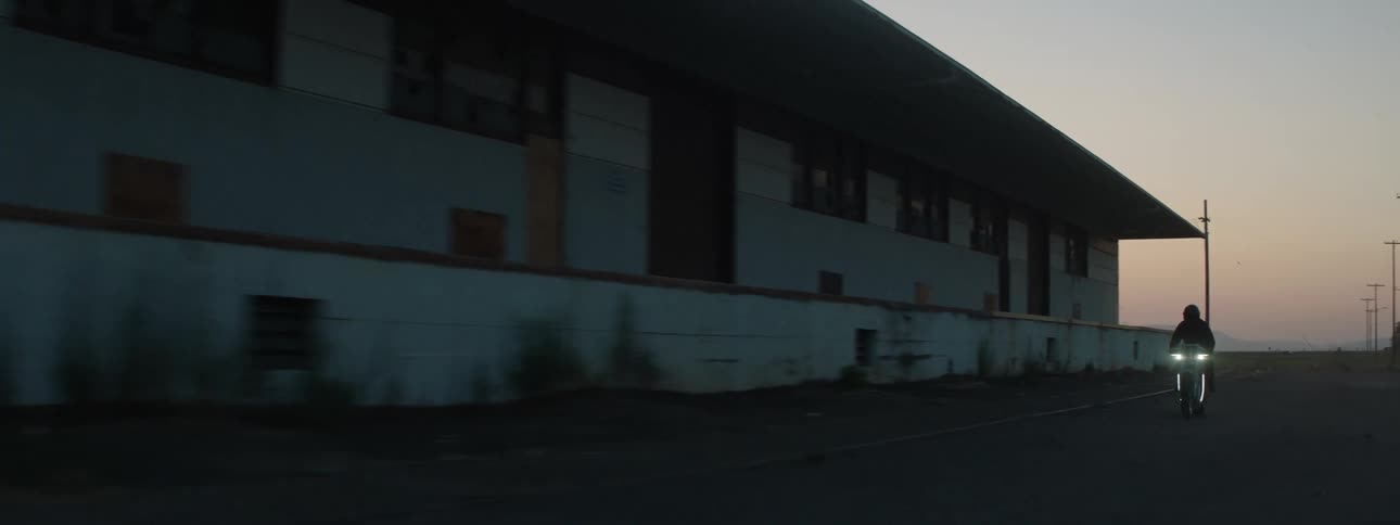 A person drives past the warehouse
