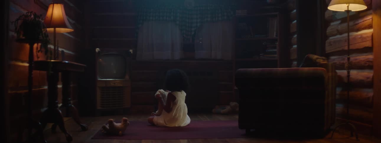 A little girl playing with her toy all alone in the living room the room is quiet and peaceful as she enjoys her playtime with her favorite toy