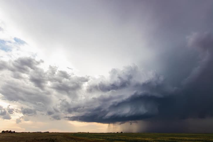 A supercell beginning to form and flash lightning