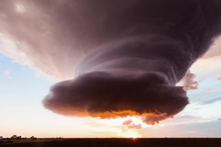 A stunning supercell at sunset over the farmlands