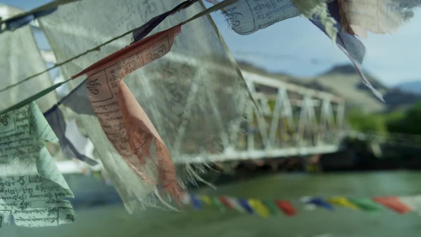 Flags hang from the bridge