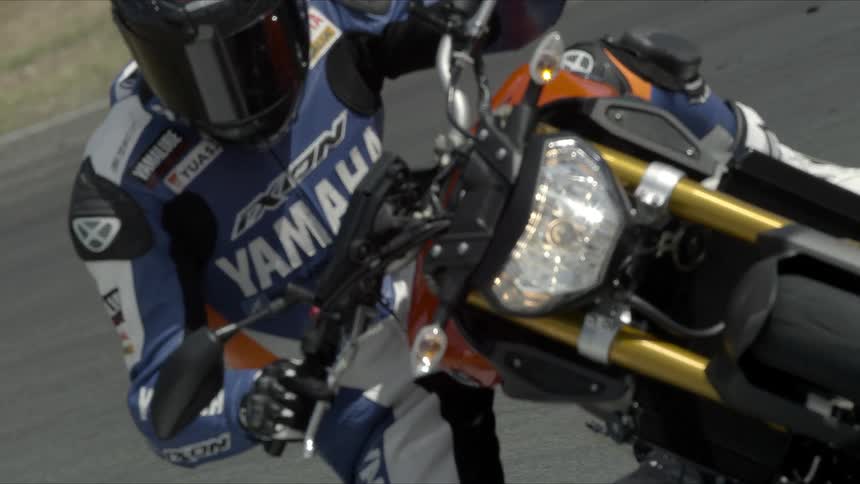 Skilled rider as he races his bike on a track pushing himself to the limit in this intense competition