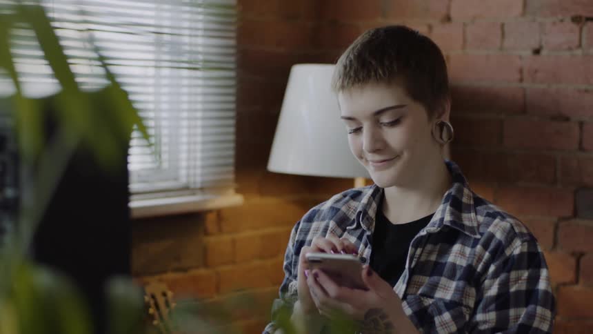 A woman uses her phone
