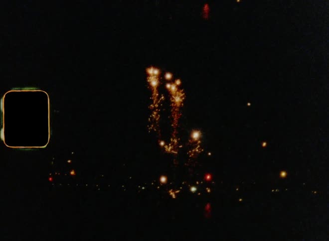 A fire work show lights up a city during the night time for a celebration