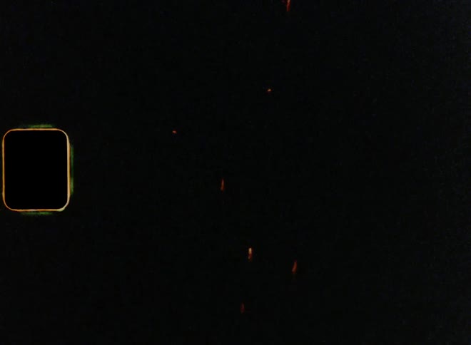 Fireworks going off with bright golden sparkles in the night sky on New Year’s Eve