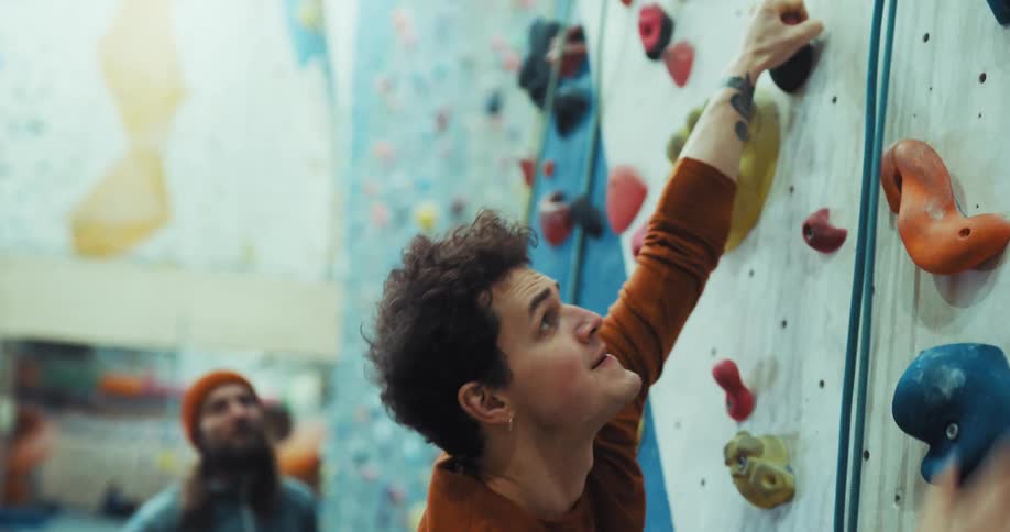 A man climbs up the wall