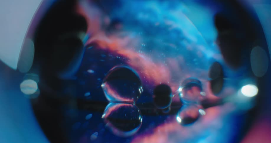 A glass sphere appears to reflect an image of outer space