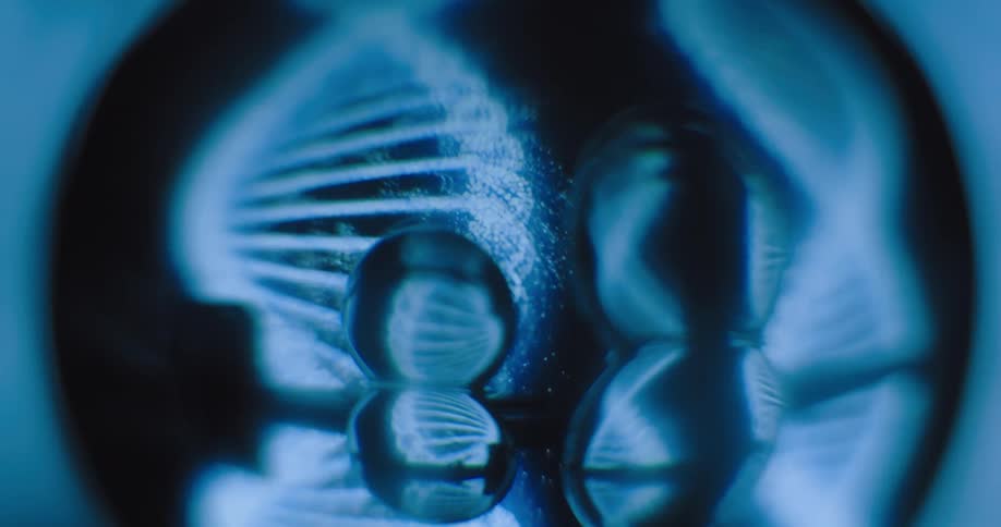 A double helix moves under a microscope