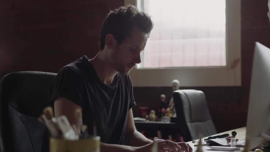 A man is using a computer