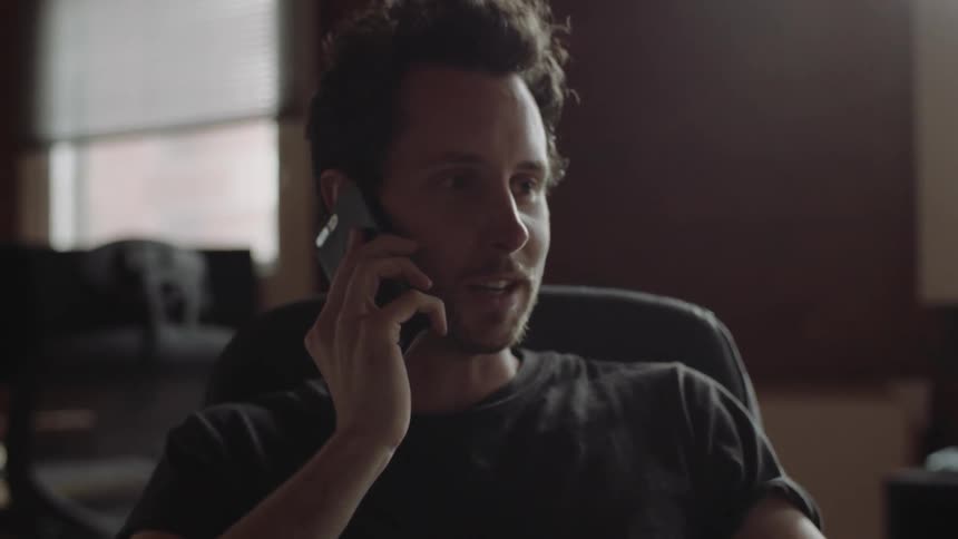 A man is talking on the phone