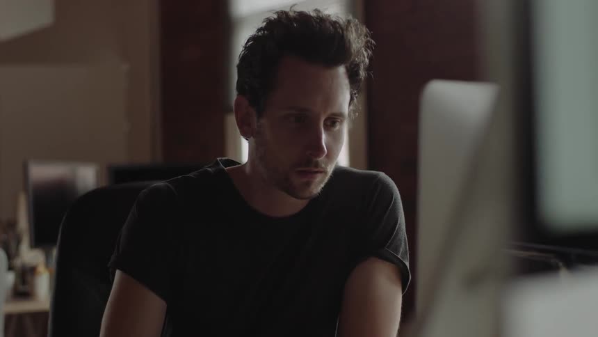 A man is using a computer