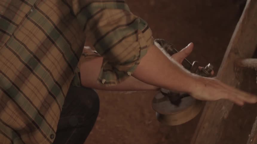 A man is brushing off a device