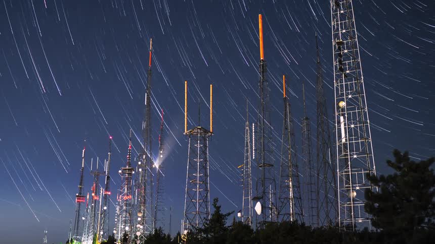 Broadcast station against starry sky