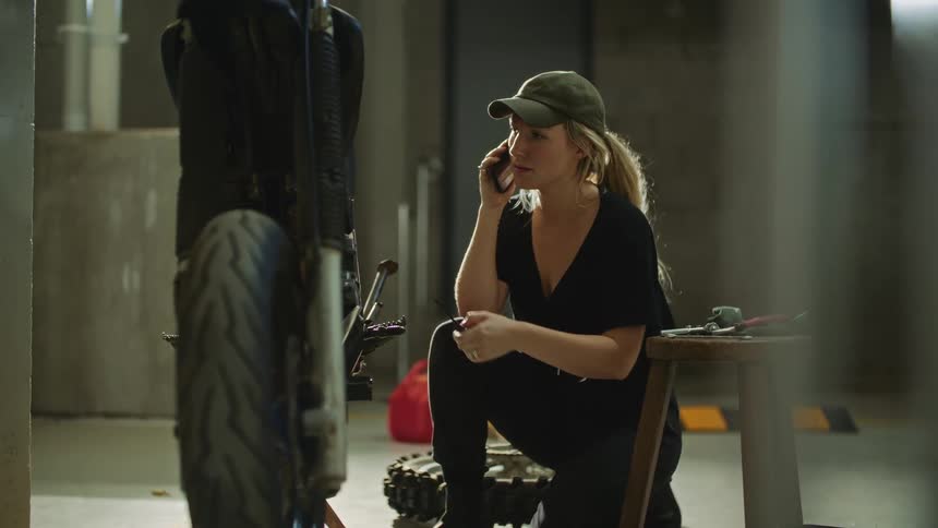 A mechanic talks on the cell phone