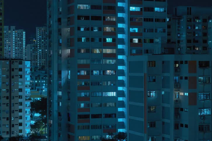 City lights flickering from buildings at night