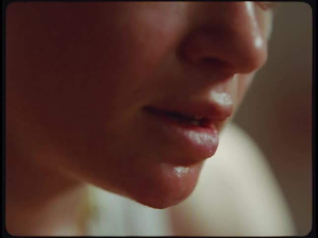 A young woman is working out and is sweating