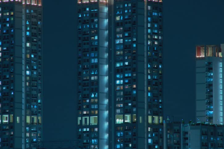 The lights in the apartments flash and pulse