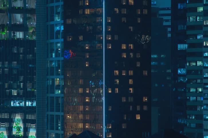 City lights twinkling from skyscrapers at night