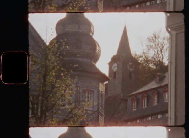A clock tower and building on an autumn day