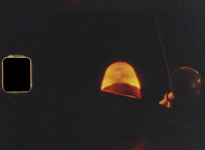 An emergency light flashing on top of a vehicle