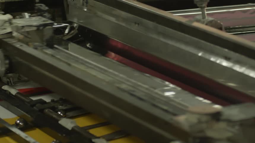Machine squeegee and washing glass in factory
