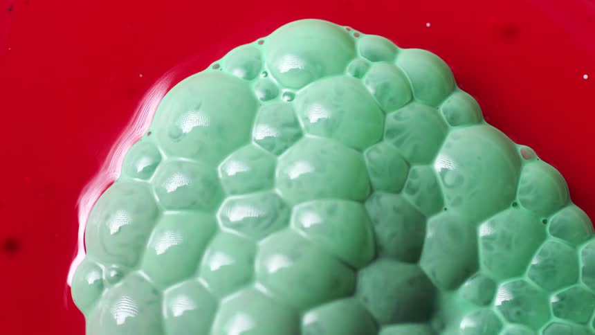 Green bubbles cover the red ink