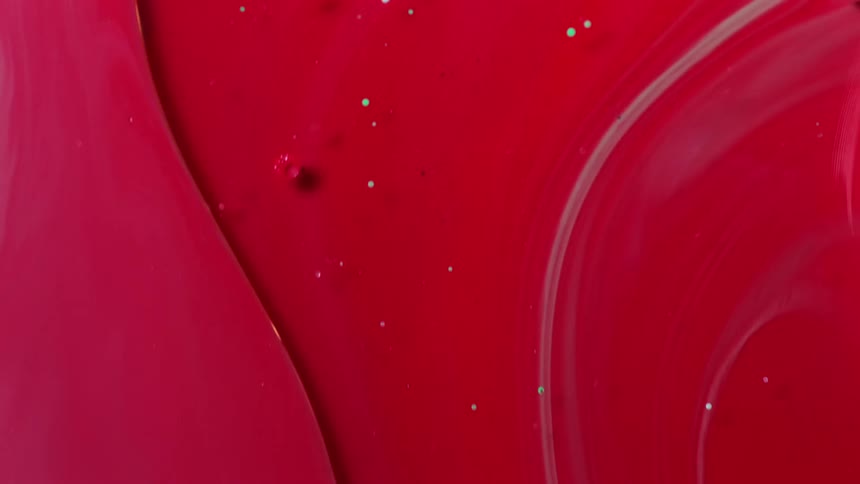 Colored orbs float over a red surface as it moves