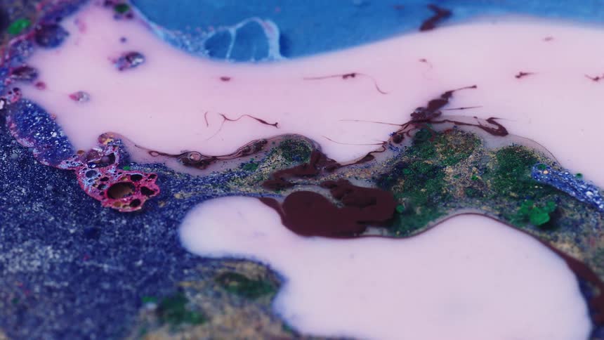 Different paint colors are being mixed together