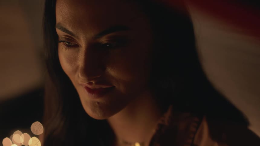 The view is of a young woman and she is smiling
