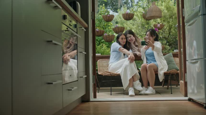 Three women are taking a picture together