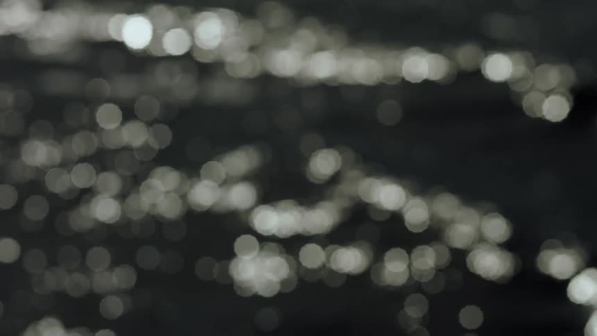 A blurry image with pixelated reflections