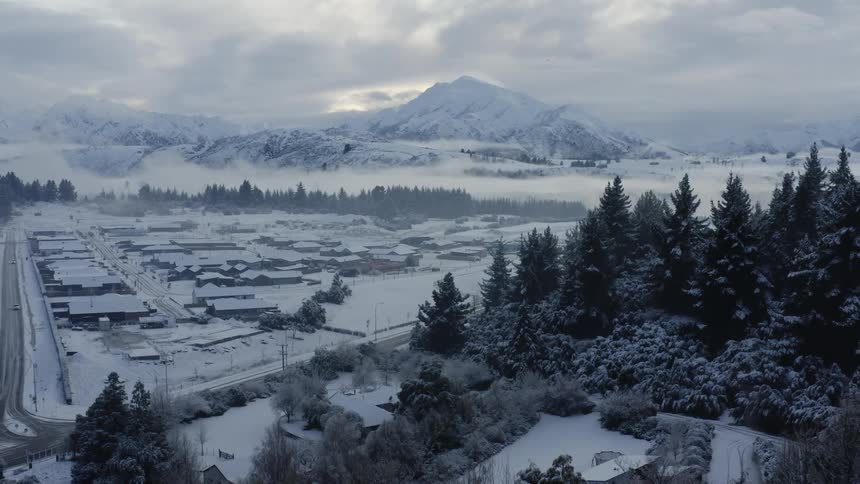 Aerial view of a winter landscape is displayed