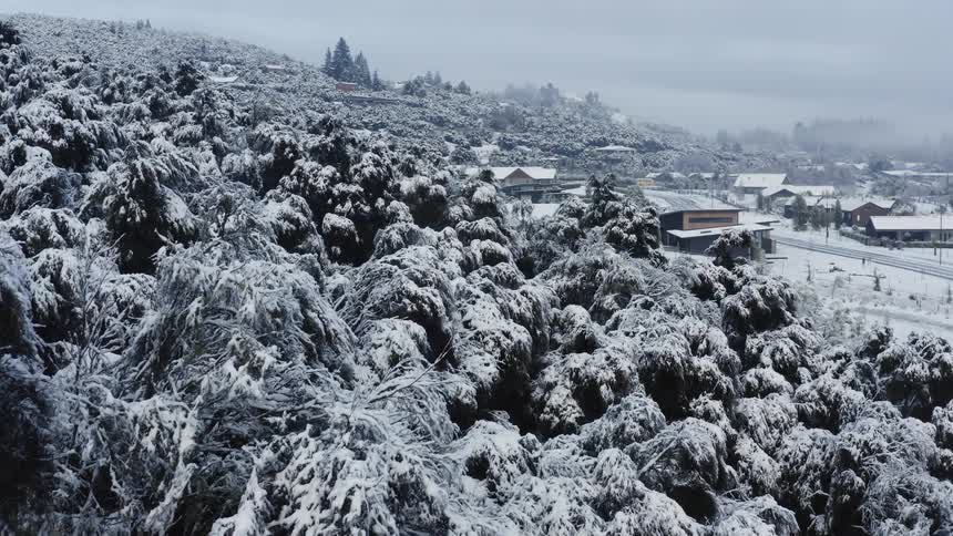 Aerial view of a rural neighborhood during winter is displayed