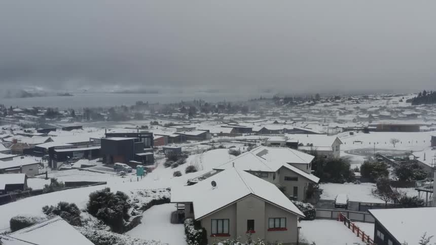 The view is of a town around the winter time